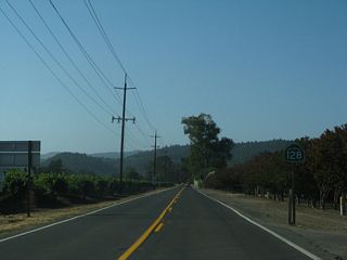 This SR 128 east reassurance shield appears along Conn Creek Road north of Rutherford Road.