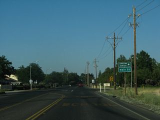 Main Street arcs southeast along the old route of SR 128 to historic Downtown Winters.