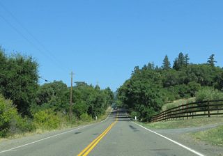 SR 128 proceeds southeast from Alderglen Springs into Oat Valley.