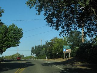 The state route emerges from the rugged terrain of the Vaca Mountains at Pleasants Valley Road. Pleasants Valley Road runs south through Pleasants, Vaca and Lagoon Valleys to Interstate 80 at Exit 51 A.