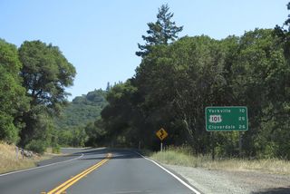 A distance sign for Yorkville, the interchange with U.S. 101 and Cloverdale follows Robinson Creek along SR 128 eastbound.