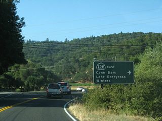 SR 128 turns east on Silverado Trail for 0.12 miles to span Conn Creek. Silverado Trail runs northwest to Calistoga and south to the city of Napa.