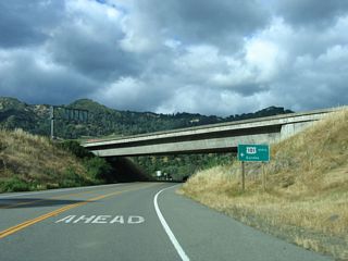 U.S. 101 Business returns to U.S. 101 at the succeeding entrance ramp. U.S. 101 travels north to Ukiah while Redwood Highway spurs north to McCray Road. The bridge taking old U.S. 101 across the Russian River was demolished.