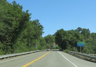 SR 128 ties into U.S. 101 Business on the north side of the Cloverdale city limits. U.S. 101 Business south along Cloverdale Boulevard to Downtown Cloverdale doubles as SR 128 Business, though no signage is posted for the designation along SR 128.
