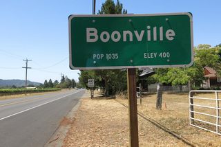 California 128 enters the unincorporated community of Boonville, which had a population of 1,035 as of the 2010 Census and sits at an elevation of 400 feet.
