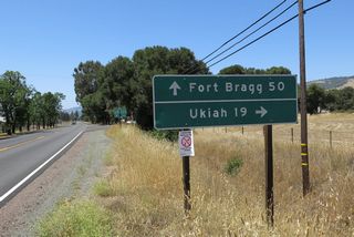 Westbound California 128 approaches California 253. Turn right to follow California 253 east to Ukiah or proceed ahead on California 128 to Boonville and Fort Bragg.