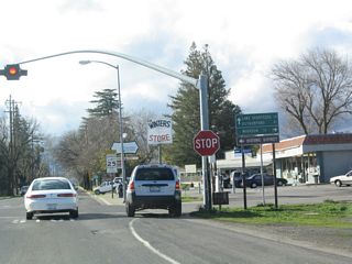 Removed when the intersection was upgraded with traffic lights by 2007, this distance sign posted along Grant Avenue west at Railroad Avenue alluded to Railroad Avenue as the original route that predated Interstate 505. Railroad Avenue / Road 89 runs north from Winters to Madison.