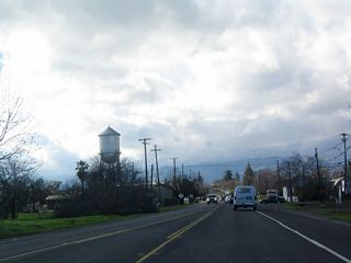 Following Grant Avenue, SR 128 enters the city of Winters west from the exchange with I-505. Winters was home to 6,125 people as of the 2000 Census. The city sits at an elevation of 131 feet, and consists of 2.8 square miles in area.