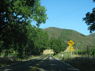Continuing east, California 128 (Sage Canyon Road) passes through some vineyards and large tracts of open space south of Elder Valley and Soda Valley.