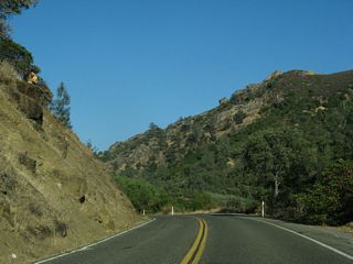 California 128 gradually descends toward the Central Valley alongside Putah Creek.