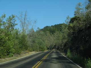 Continuing east, California 128 (Sage Canyon Road) skirts the southern edge of Hennessey Lake, which is held back by Conn Dam and supplies drinking water to the city of Napa.