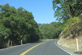 SR 128 switches sides with parallel Dry Creek at milepost 43.44.