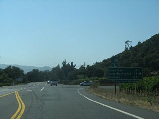 Entering Napa Valley from the area near Lake Hennessey, SR 128 dog legs north along Silverado Trail between Sage Canyon Road and Conn Creek Road.
