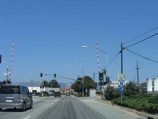 Eastbound California 129/Riverside Drive approaches Walker Street and the railroad tracks. Walker Street serves as part of a truck route to facilitate truck traffic routing in and around downtown Watsonville. To the northwest, Walker Street connects to Beach Street and Ford Street before changing into Harkins Slough Road near Ramsay Park.