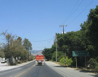 A mileage sign is posted shortly thereafter for the junction with U.S. 101 (El Camino Real) (13 miles), San Juan Bautista (16 miles), and Hollister (20 miles). The latter two destinations are reached via U.S. 101 south to California 156 east.