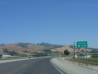 Eastbound California 129/Riverside Drive approaches Thompson Road northeast to Carlton Road north. Use Carlton Road north to California 152 (Hecker Pass Road); Carlton Road also serves as a farm-to-market road in this fertile plain. After this intersection, California 129 turns southeast toward Pajaro Gap.
