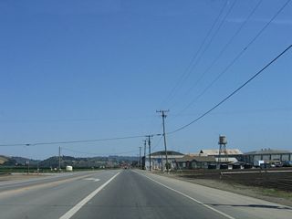 Now traveling southeast, California 129 approaches Silliman Road and a somewhat industrial looking area.
