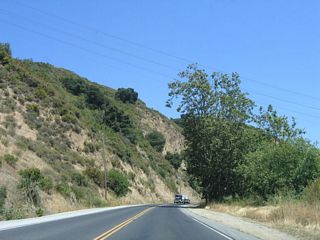 The 500 kV power line and a companion 230-kV power line cross high above Pajaro Gap. California 129 continues east toward its junction with U.S. 101.