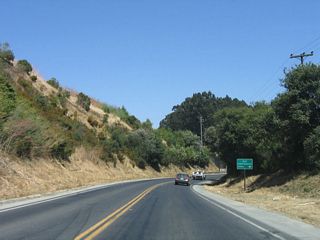 Eastbound California 129 approaches Old Chittenden Road, which is located immediately after passing through the subway undercrossing for the Union Pacific Railroad.