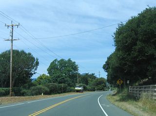 Prior to the construction of a vehicular highway to Tiburon (California 131), land access was provided by the North Pacific Railroad, which was built in 1884 and connected Tiburon with San Rafael. Ferry piers on Tiburon Peninsula were built as part of the original railroad construction; Colonel Peter Donahue led the effort to extend the railroad to Tiburon. Rail service lasted until 1967.&sup1; The railroad right of way is now a multi-use path along the bayshore, generally parallel to California 131.