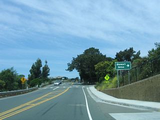 Westbound California 131 (Tiburon Boulevard) approaches Stewart Drive (right turn, no traffic signal). Most of these side streets serve residential areas. Blackie&#039;s Pasture, through which California 131 passes, was home to a horse named Blackie who lived in the pasture for 40 years and was a fixture to passing travelers.&sup1;