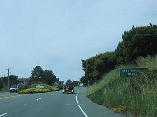 After passing by Trestle Glen Road, California 131 west expands to a four-lane expressway configuration. The next right turn is for Reed Ranch Road.