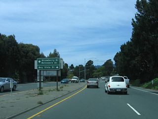 The next intersection along the expressway segment of California 131 is for Strawberry Drive/Belvedere Drive and Bay Vista Drive north.