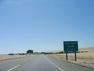 California 132 commences east along the transition ramp from eastbound Interstate 580 (William Elton Brown Freeway) to Exit 7 A. The first exit on eastbound California 132 is with Chrisman Road north to Tracy.