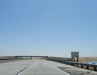 California 132 passes over the California Aqueduct, which carries water from the California Delta Region to Southern California. The aqueduct is named in honor of California Governor Edmund "Pat" G. Brown.