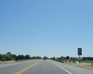 Eastbound California 132 (Maze Boulevard) crosses the San Joaquin River. Any expansion to four lanes will require a bridge over this area, thus driving up the cost.