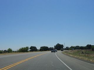 After departing the San Joaquin River bridge, eastbound California 132 (Maze Boulevard) skirts the wetlands and wildlife areas near the river.