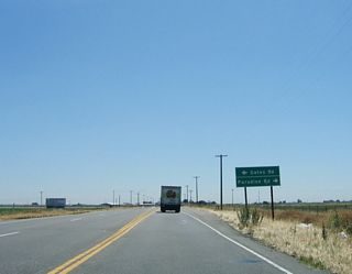 Leaving the wetlands near the river, California 132 returns to a farm and ranch area. The next intersection along eastbound California 132 is with Gates Road north and Paradise Road south.