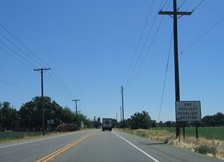 The daytime headlight section ends after the intersection with Grimes Avenue on the outskirts of burgeoning Modesto, which continues to expand with new housing.