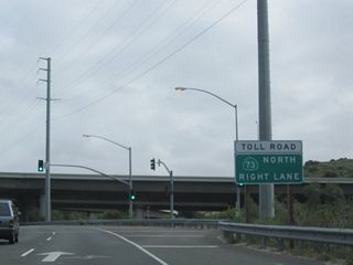 The next traffic signal is the off-ramp from California 73 south to California 133. Stay right for the connection to California 73 north.