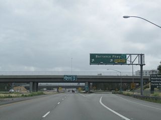 Northbound California 133 (Laguna Freeway) reaches Exit 9, Barranca Parkway.