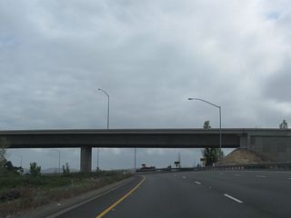 The transition ramp from California 133 (Laguna Freeway) north to Interstate 5 joins the Santa Ana Freeway under the main lanes of California 133 (Eastern Transportation Corridor).