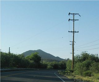 Northbound California 133 (Laguna Canyon Road) traveling through Laguna Coast Wilderness Park prior to completion of the expressway. Following completion of the expressway on August 13, 2004, this highway was abandoned in favor of the new multi-lane, divided highway.