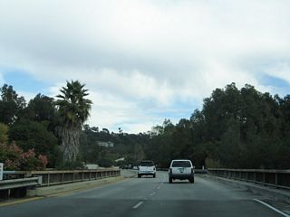 The bridge taking the Colorado Freeway east over Monte Bonito Drive includes the divoted curbing.