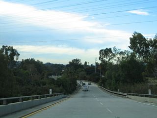 Beyond the exit to Figueroa Street, the Colorado Boulevard ramp passes over SR 134 (Ventura Freeway).