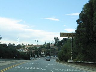 Removed by 2011, a porcelain-enamel end freeway overhead preceded the traffic signal with Colorado Boulevard.