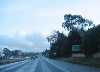 After U.S. 101 Business splits, this mileage sign provides the distance to Orcutt and Lompoc via California 135 south.