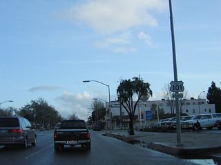 Another U.S. 101 Business reassurance shield is posted after the Fesler Street intersection.