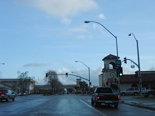 A California 166 shield is posted at the intersection with Main Street. Both U.S. 101 Business and California 135 continue south from this point.