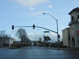 U.S. 101 Business/SR 135 (Broadway) meet SR 166 (Main Street) south ahead of the pedestrian overpass for Santa Maria Town Center.