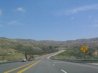 After passing Interstate 15, California 138 leaves the path of the proposed Metropolitan Bypass and begins to ascend to Cajon Pass as a much less traveled highway than the congested highway west of here.