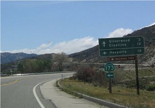 Eastbound California 138 approaching California 173 east to Mojave River Forks Regional Park and Hesperia. There is a dirt road that connects this section of California 173 with the section of California 173 near Lake Arrowhead, but it is signed as closed and is generally not a recommended through route.