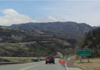 At the time this photo was taken, Silverwood Lake State Recreation Area and Cleghorn Road were closed due to fire damage. Note that California 138 remains a "Super Two" as it passes through the interchange with Cleghorn Road.