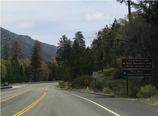 Eastbound California 138 at Miller Canyon Road west to Silverwood Lake. Miller Canyon Road is the old alignment of California 138. Due to destruction related to the Old Fire of October 2003, this road was closed.
