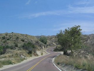 A rarity along a non-national park service roadway, California 138 has red pavement for a distance east of Interstate 15.
