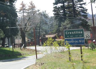 Eastbound California 138 enters Crestline, with a population of 8,600 people.